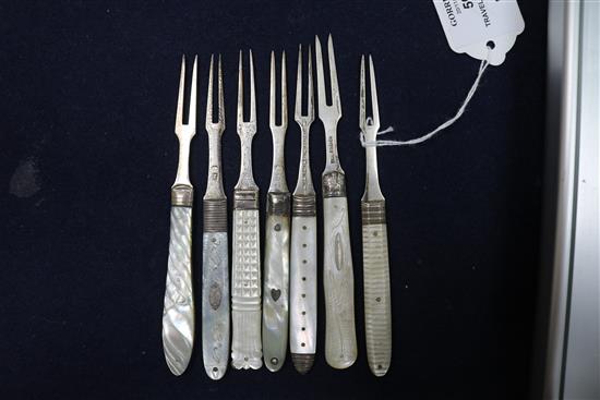Seven 19th century and later silver and mother of pearl handled travelling forks a similar silver fruit knife and three other items.